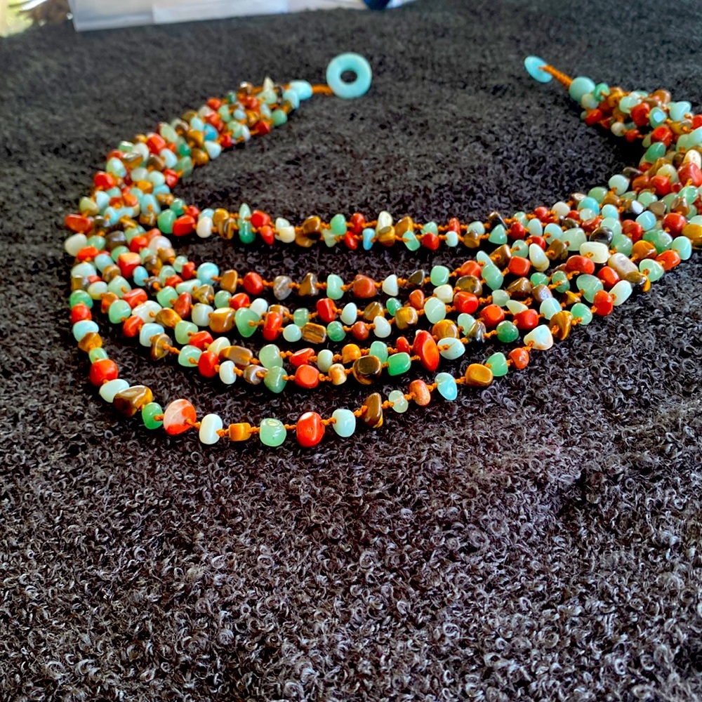Beautiful necklace eight strings of beads blues and browns very classy